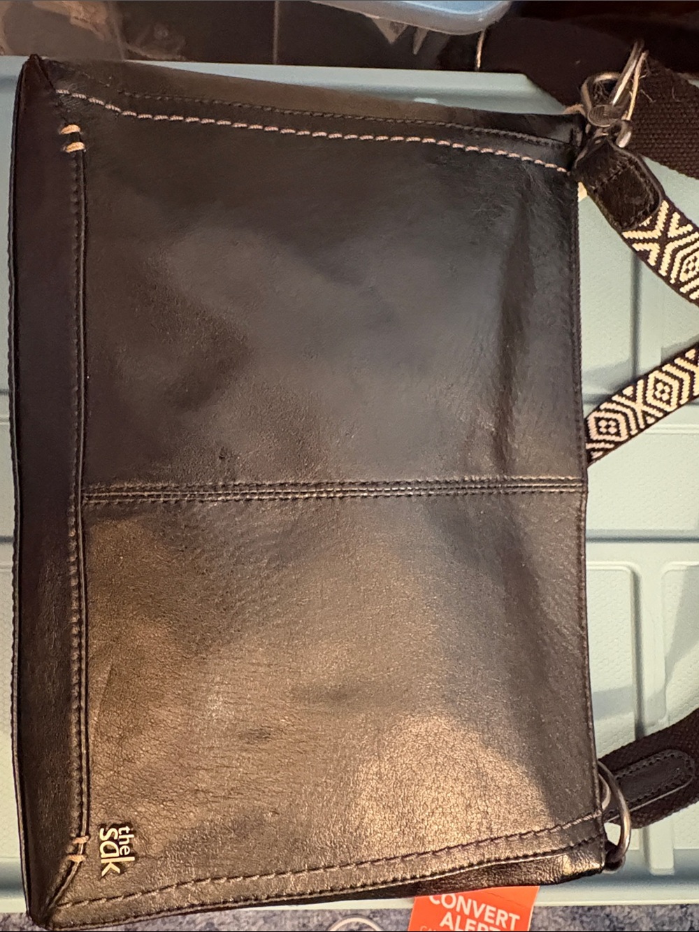 The Sak Black Leather Camilla Convertible Messenger Bag with Patterned Strap